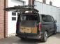 Preview: ford-tourneo--transit-custom-mit-geoeffneter-hecklappe-und-montiertem-fahrradtraeger
