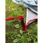 Preview: BasicNature Zelthering 'T-Stake' im Gras eingeschlagen